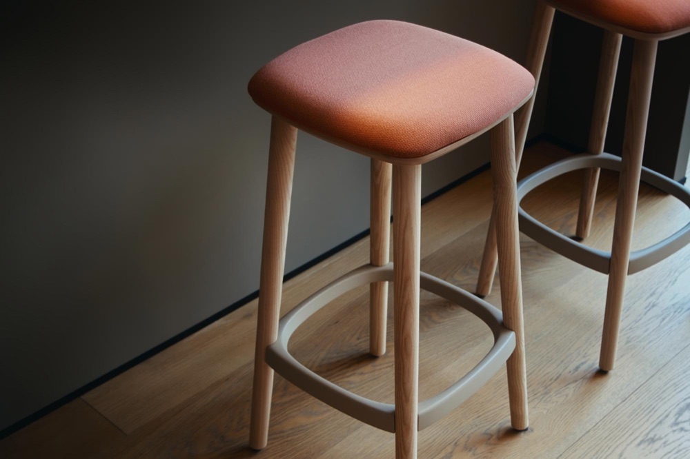 Wooden bar stool with red fabric upholstery by next125