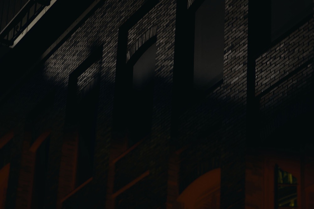 Brick façade of the Macherei in Munich at night